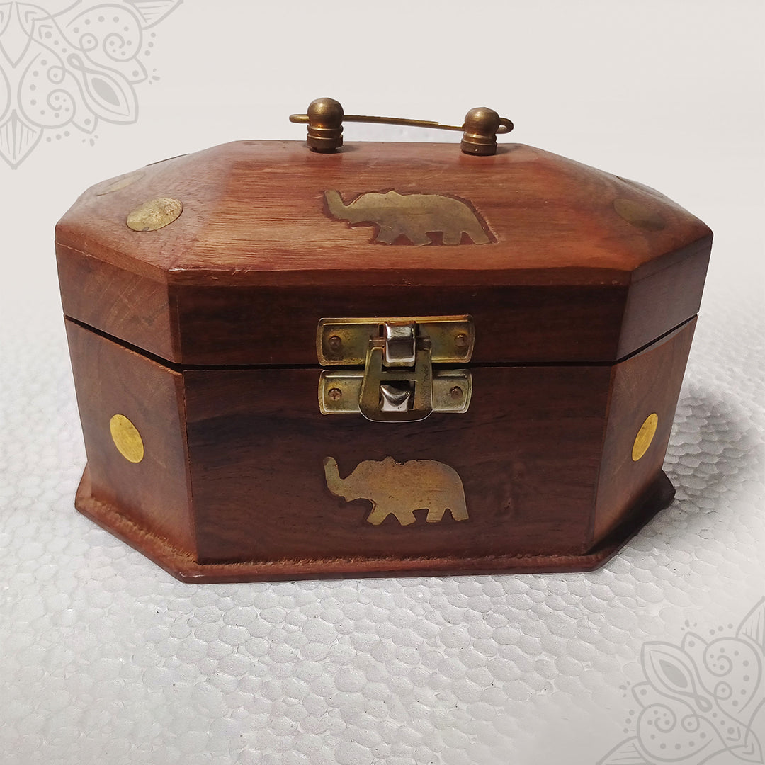 Oval shape wooden jewellery box with elephant design and brass handle straight front view for storage