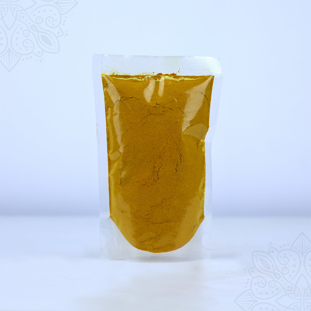 Kasthuri manjal powder 250g in a clear sealed pouch showing golden yellow turmeric powder in wider front view against a white backdrop.