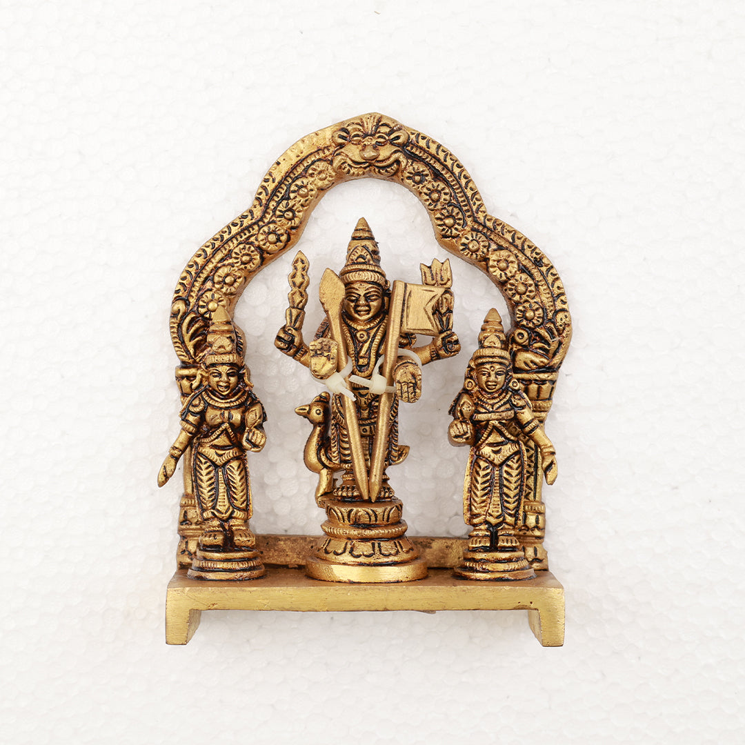 Murugan idol with Valli Deivanai peacock set holding vel in floral arch straight front view