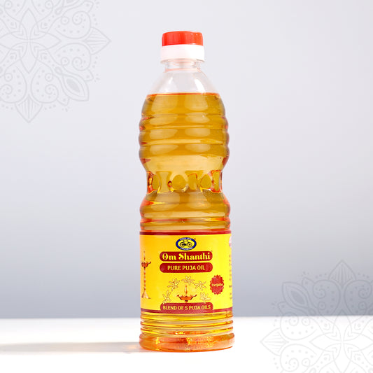 Om Shanthi Pure Puja Oil 1000ml bottle with golden oil and red yellow label