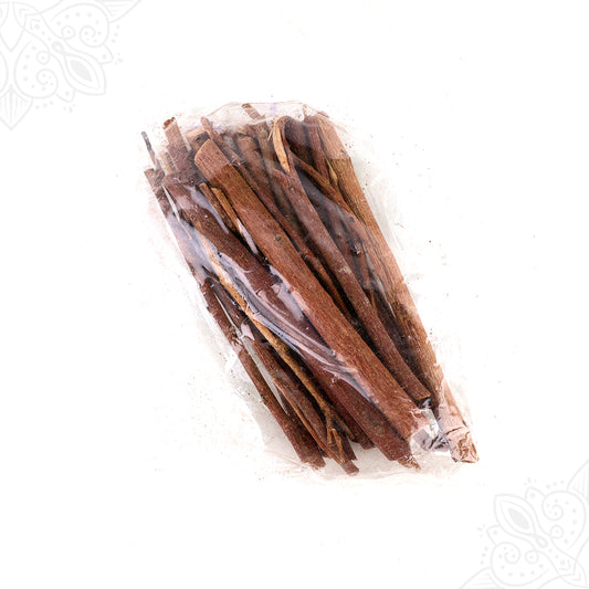 Purasu samithu sticks bundled in a clear plastic pack shown in a diagonal flat lay view against a white background