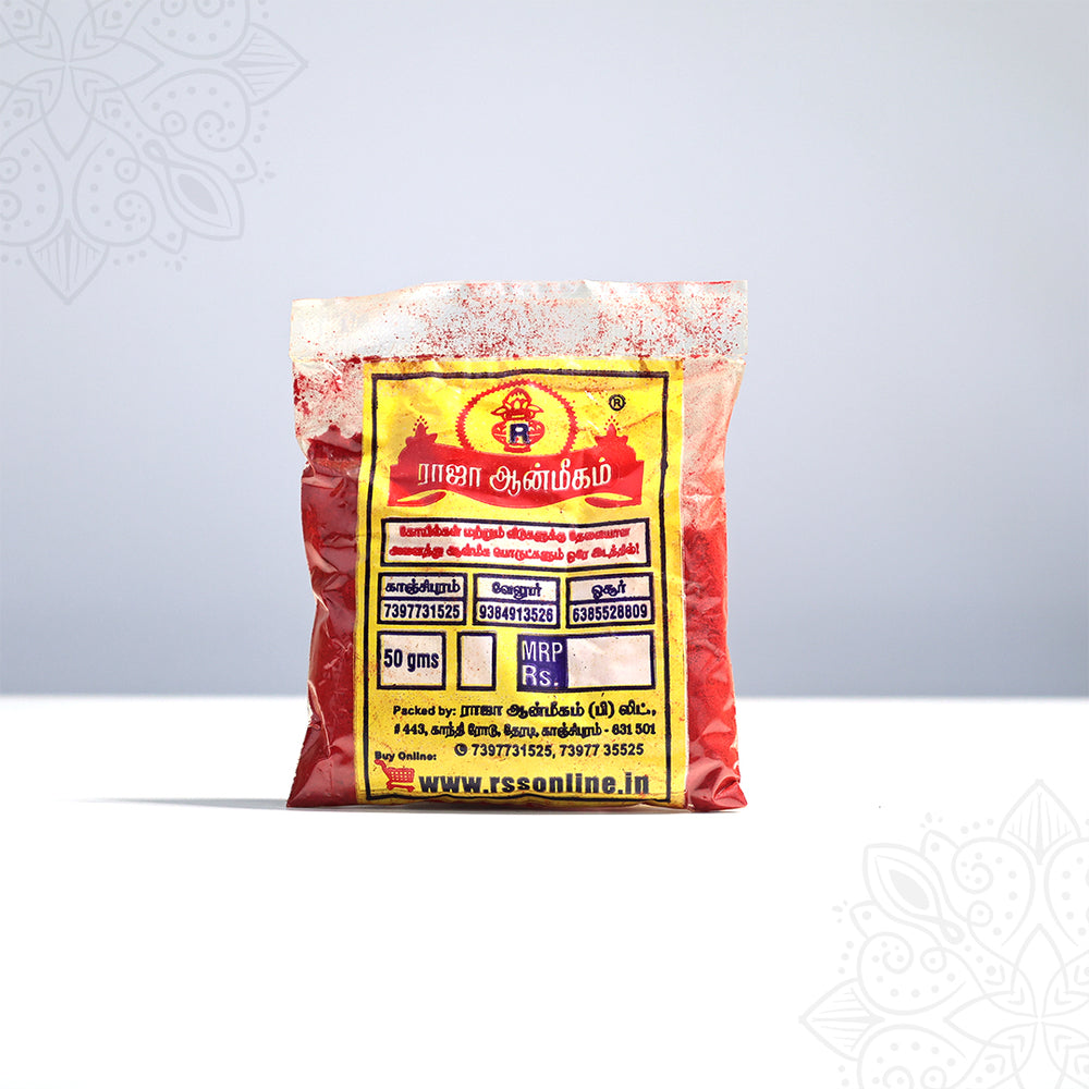 Raja Aanmeegam red kumkum 50g packet with Tamil label in slightly low front view showing full label against grey backdrop.