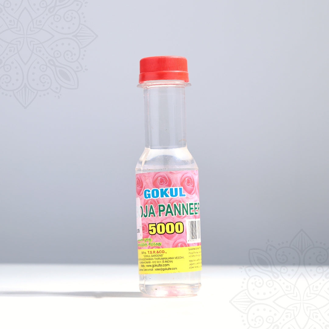 Gokul rosa panneer rose water bottle in a front-facing view showing pink rose label with red cap against a grey background