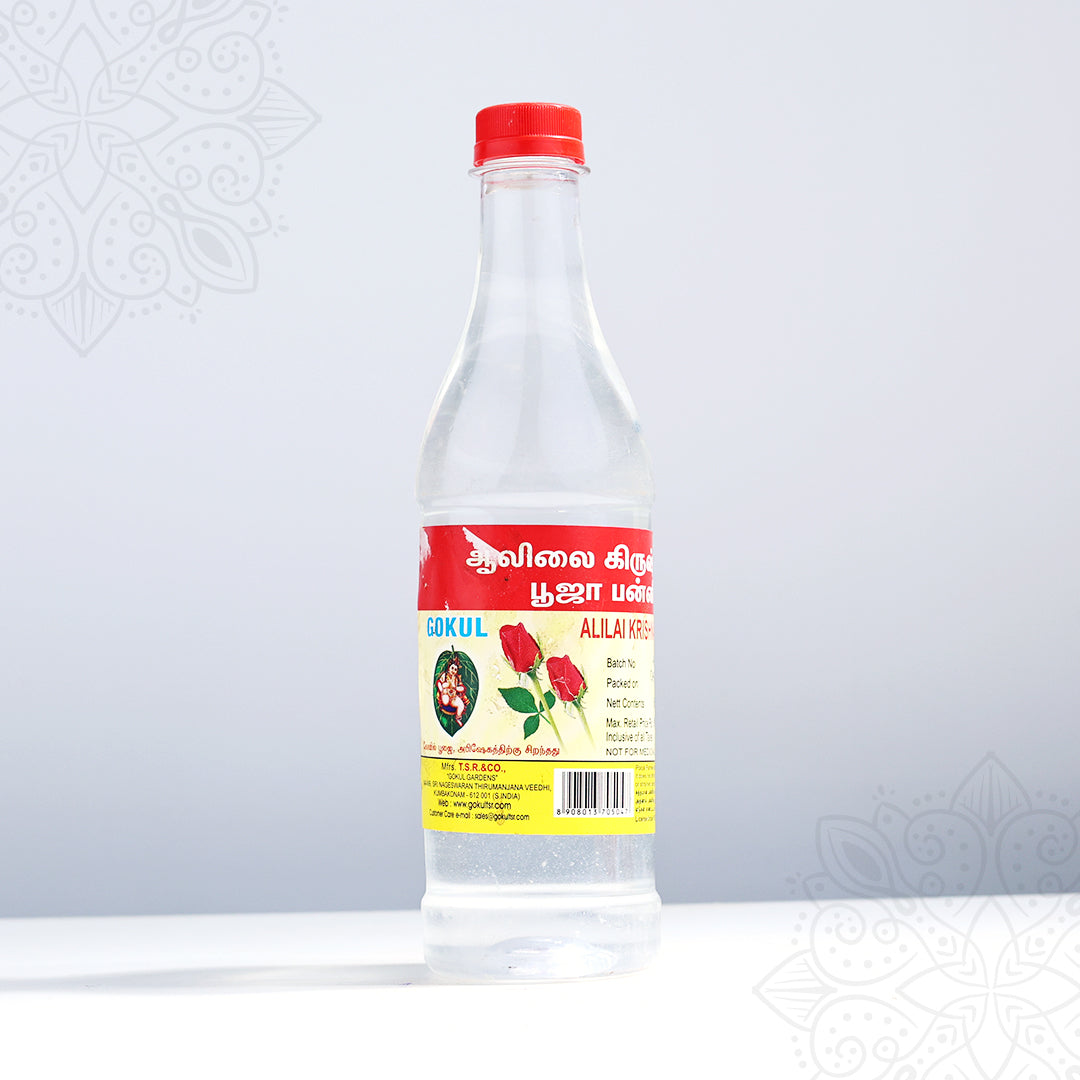 Gokul rose water large puja bottle in a front-facing view showing Tamil label with red rose print and red cap against a grey background