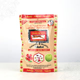 Front view of Tiger Brand special shikakai powder pack with herb and fruit prints on cream pouch against white background
