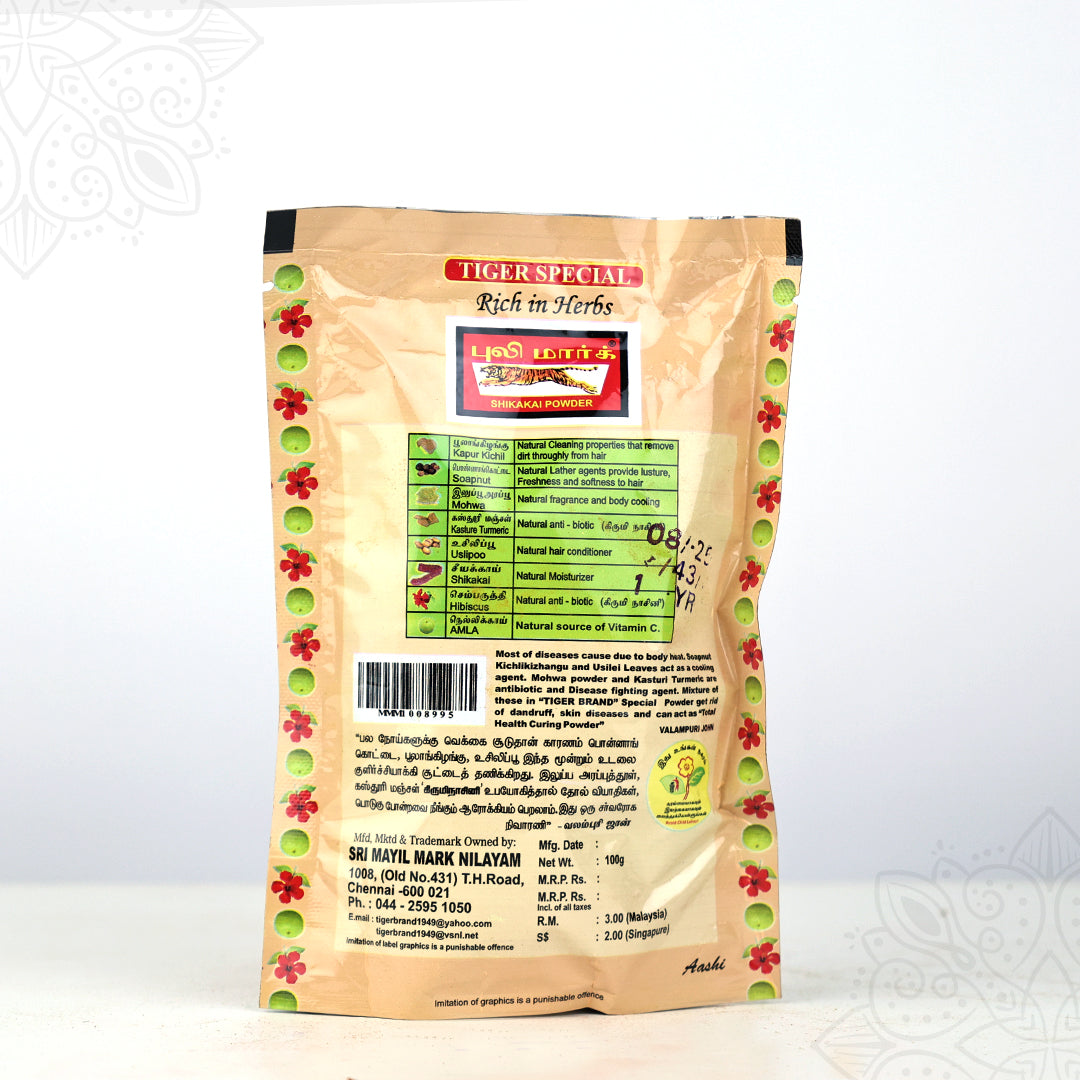Back view of Tiger Brand special shikakai powder pack showing ingredients and manufacturer details on cream pouch
