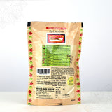 Back view of Tiger Brand special shikakai powder pack showing ingredients and manufacturer details on cream pouch
