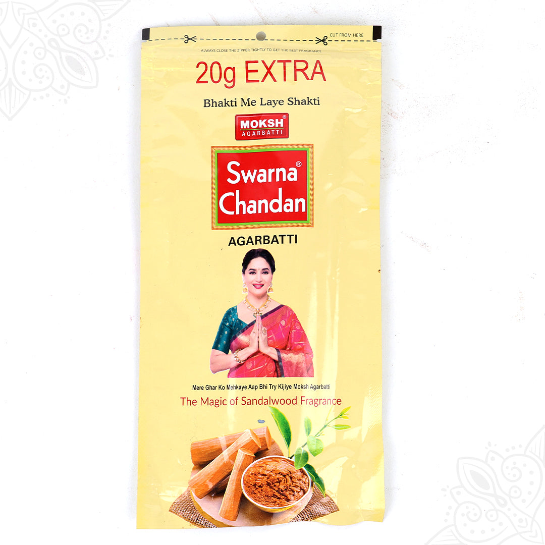 Front view of Moksh Swarna Chandan agarbatti 20g extra pouch with sandalwood print on yellow pack on white surface