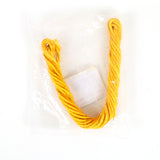 Handmade thali saradu two line yellow twisted rope folded in a U shape with a label card packed in clear cover in a flat lay top-down view