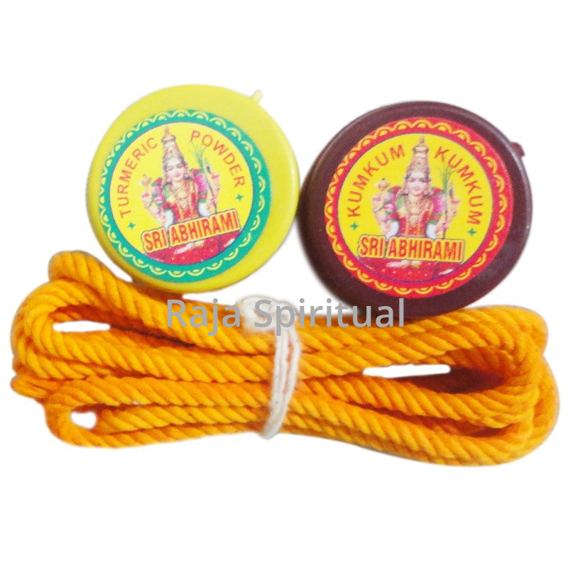 Sri Abhirami thali saradu combo set with turmeric and kumkum boxes with yellow sacred thread shown in front view against white backdrop.