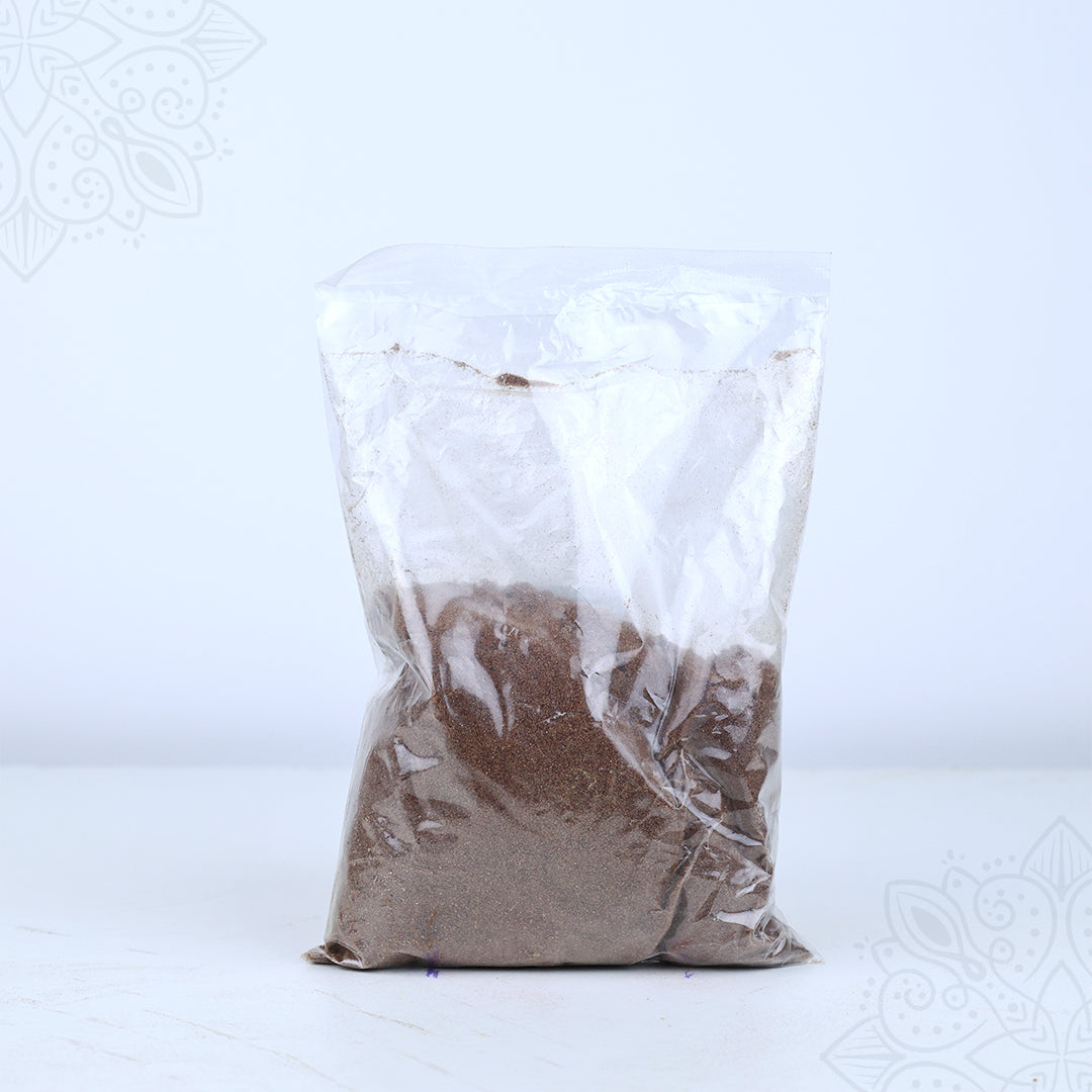 Front view of thirtha parimalam powder packed in a clear plastic bag on white surface
