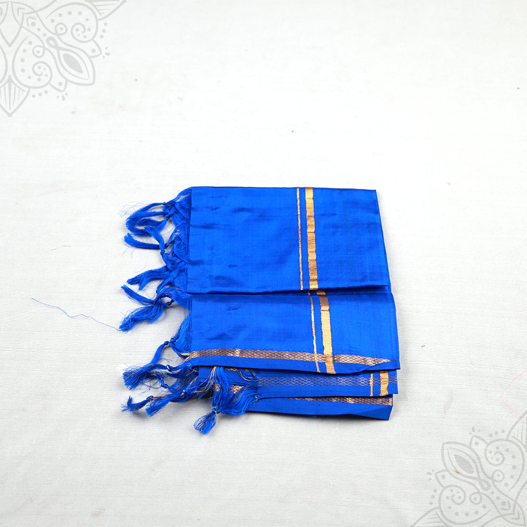 Blue Pure Pattu Thundu with a gold border shown folded in a slight right-side view.