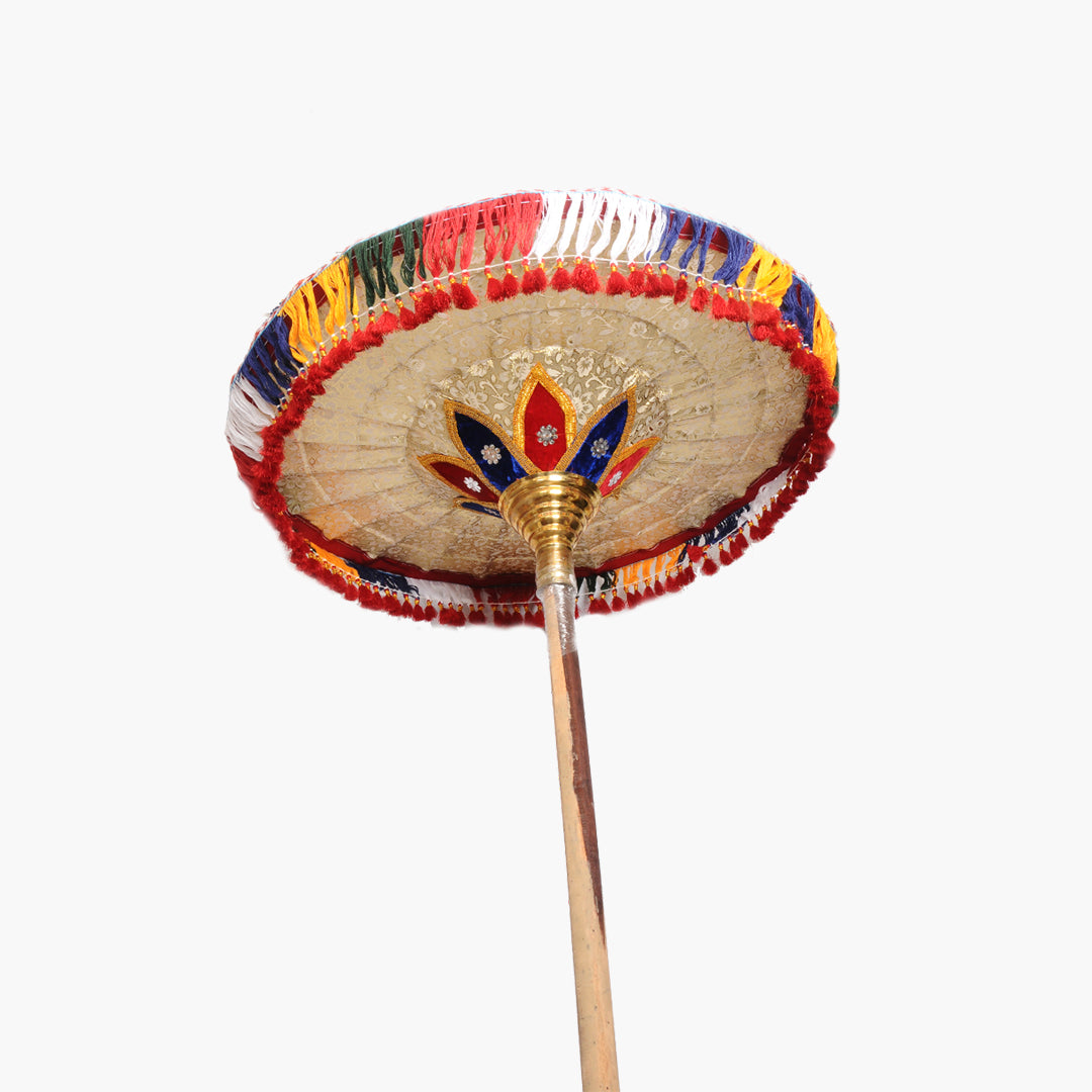 Tirupathi umbrella low bottom up angle showing canopy depth longer pole lotus center and full multicolor fringe all around