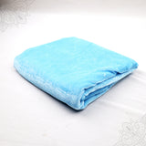 Sky blue velvet cloth 1 meter folded neatly on white background top angle view for pooja decoration