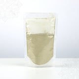 Front view of vilvam powder packed in a clear plastic pouch on white surface